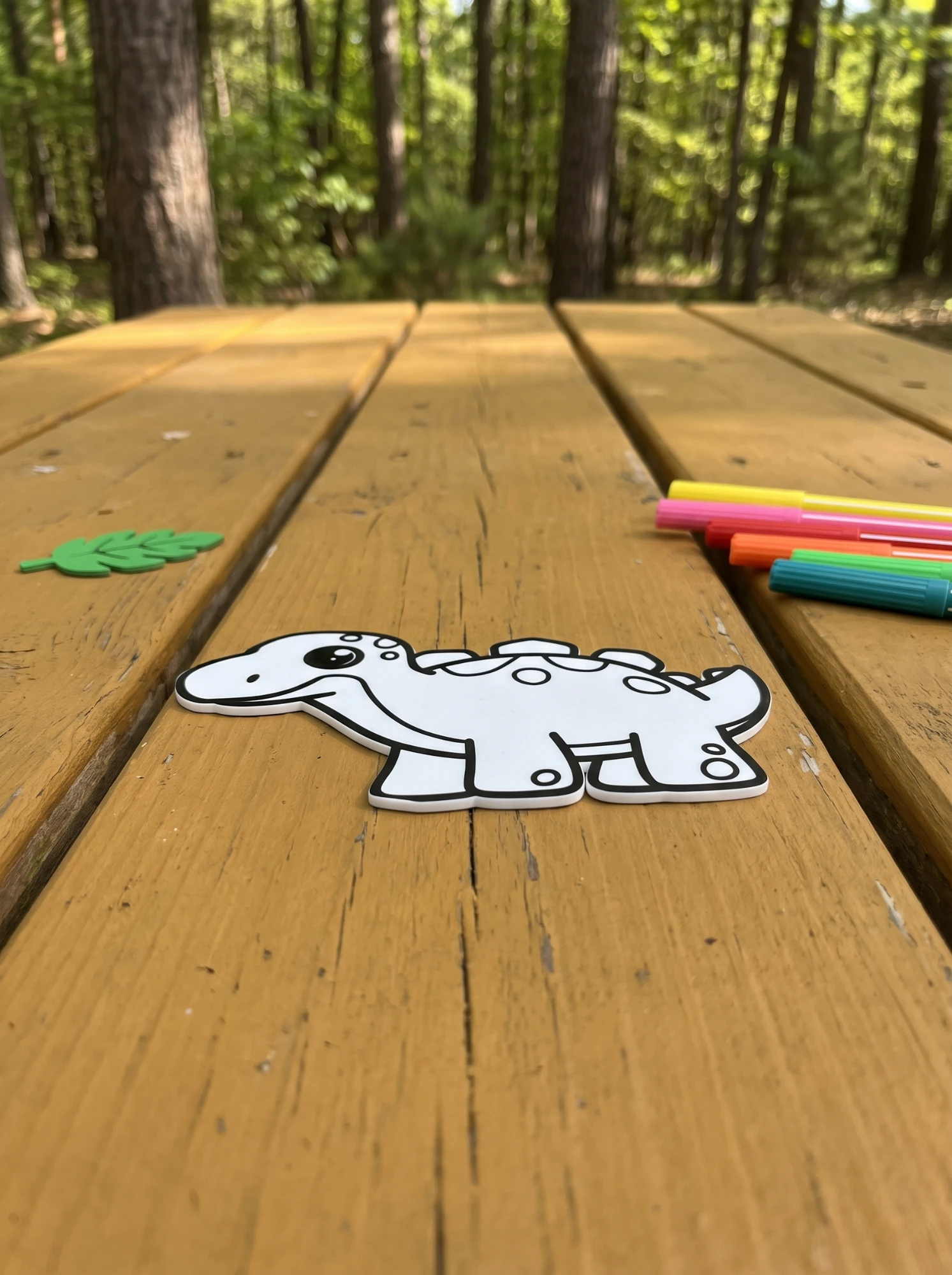 Stegosaurus on a forest picnic table